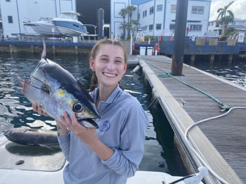 young woman holding a fish